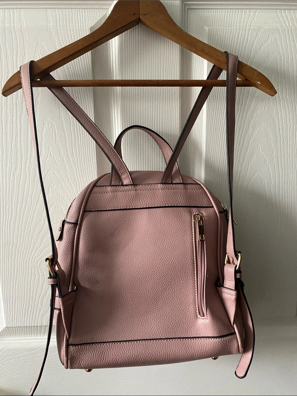 Blush Pink Mini Backpack with Gold Hardware and Striped Lining.